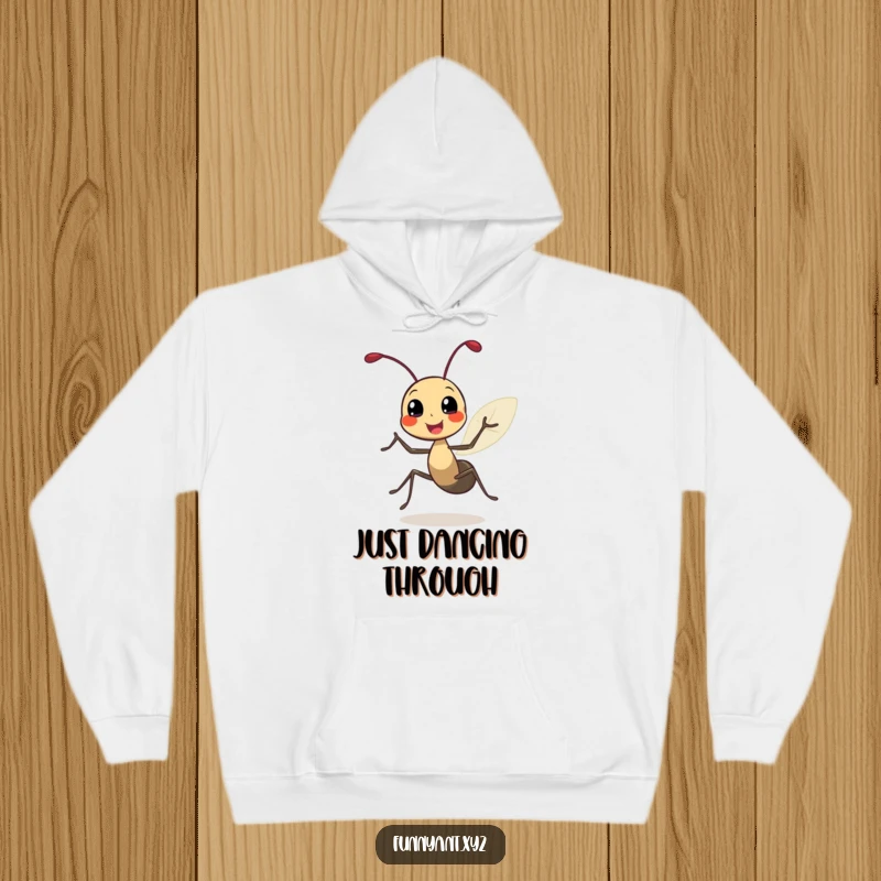 Funny hoodie depicting a cute ant character doing a joyful spin with its leafy antennae bouncing, symbolizing pure celebration and fun.
