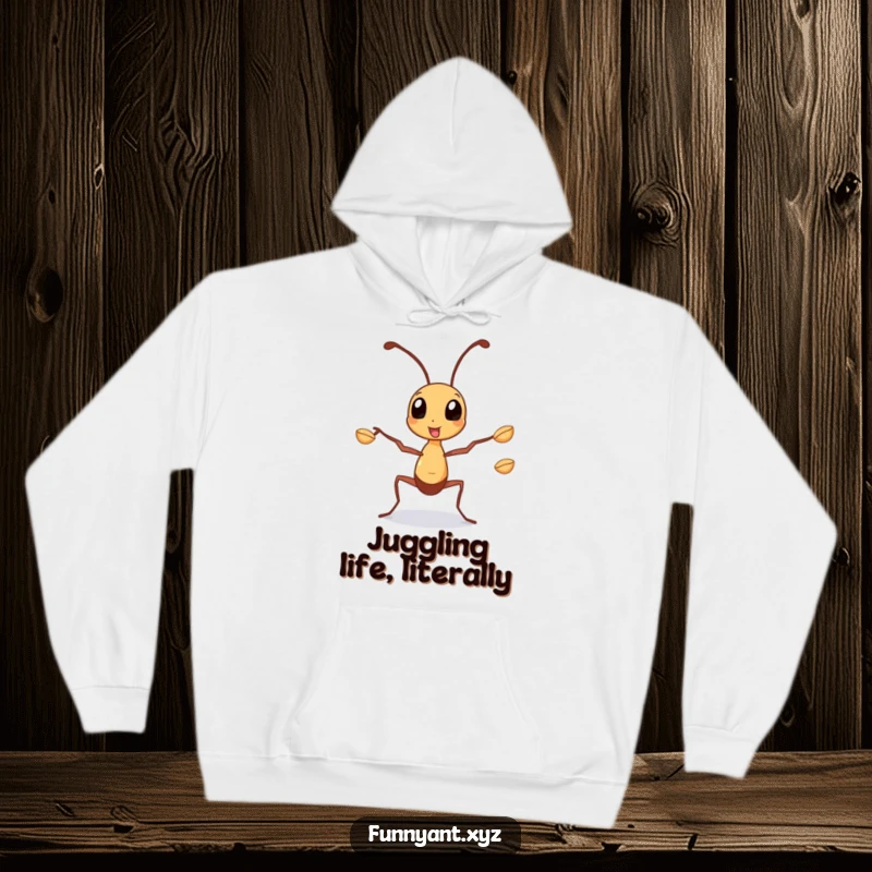 Funny Hoodie: A busy ant character juggling tiny seeds with its legs, embodying focus and hard work in a comfortable design.
